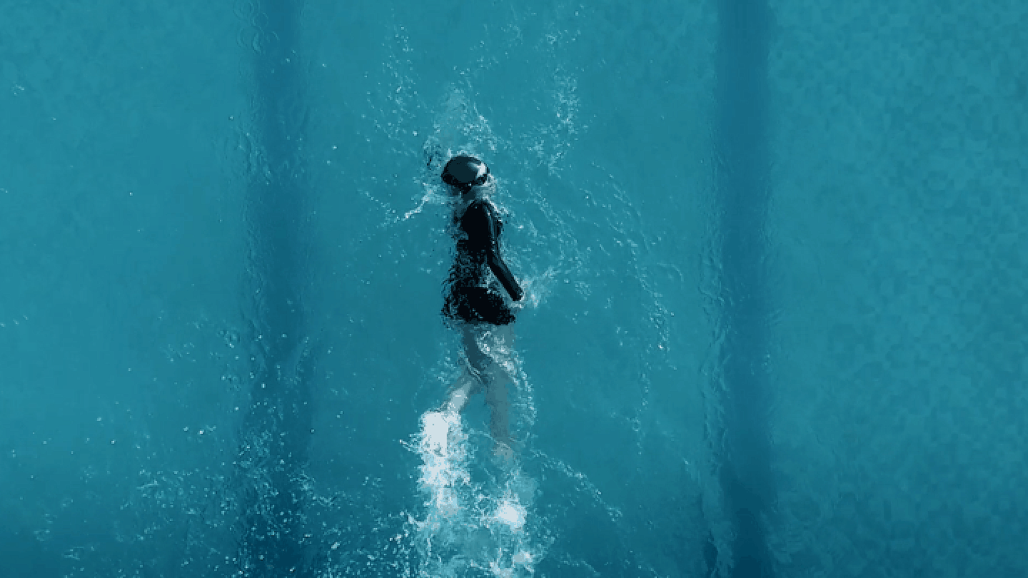 Student swimming in the campus swimming pool